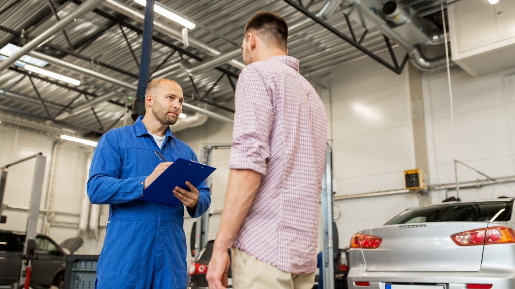 Technician reviewing diagnostic results with a customer